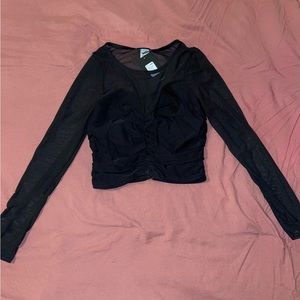 Black crop top with shear sleeves.